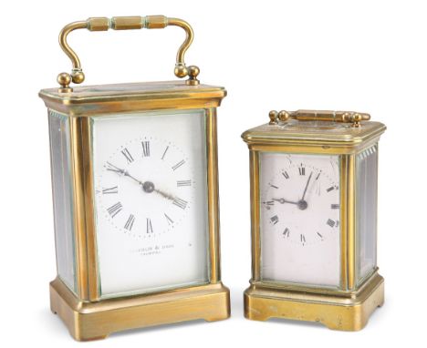 A BRASS CASED CARRIAGE CLOCK, the white enamel dial with Roman numerals, signed 'FRANKLIN &amp; HARE / TAUNTON', 11cm high ex