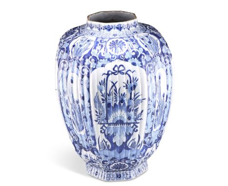 A LARGE 18TH CENTURY DUTCH DELFT BLUE AND WHITE VASE, of ribbed octagonal baluster form, with conforming rim and foot, decora