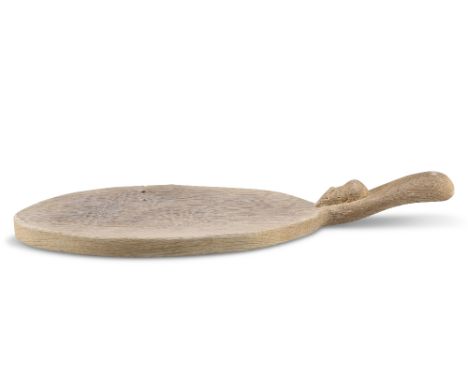 ROBERT THOMPSON OF KILBURN, A MOUSEMAN OAK CHEESEBOARD, adzed oval form, with carved mouse signature to the handle. 37.5cm ov