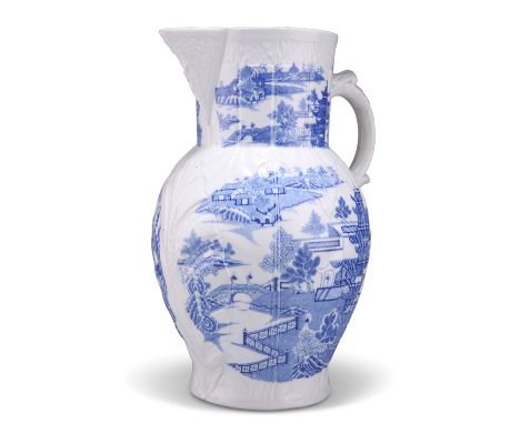 A LARGE 18TH CENTURY ENGLISH BLUE AND WHITE CABBAGE LEAF JUG, with moulded body and mask spout, Willow pattern, base unmarked