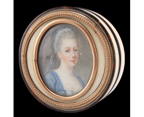 AN IVORY AND TORTOISESHELL SNUFF BOX, circular form and mounted with tortoiseshell, the cover inlaid with an oval portrait mi