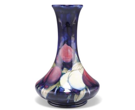 A WILLIAM MOORCROFT POTTERY VASE,&nbsp;squat baluster form with a long flared neck, 'Plum Wisteria' pattern, tubelined and ha
