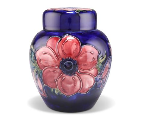 A WALTER MOORCROFT POTTERY GINGER JAR AND COVER,&nbsp;'Anemone' pattern, tubelined and hand-painted in tones of purple and gr