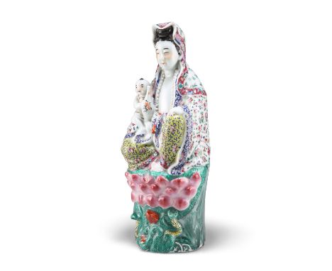 A CHINESE FAMILLE ROSE FIGURE OF GUANYIN, probably late 19th Century, impressed seal to base. 35cm highCONDITION REPORTLosses