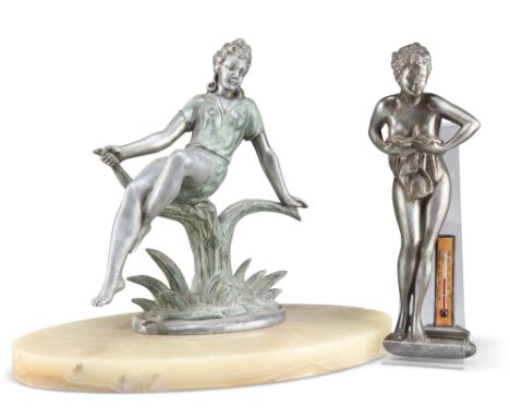AN ART DECO STYLE METAL FIGURE, the young lady cast reclining on a stump, raised on an oval onyx plinth, 26.5cm high; togethe