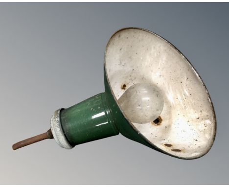 A vintage industrial green enamelled metal light fitting.
