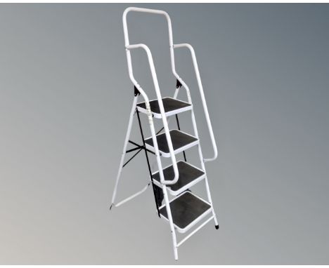 A four-tread folding step ladder with double hand rail 