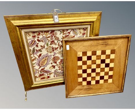 An ornate gilt-framed firescreen with an inset floral tapestry panel. on twin brass feet and brass carrying handle, overall d