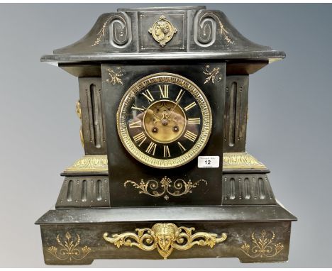 A splendid Victorian black slate and brass-mounted 8-day mantel clock, the architectural case with scrolling floral decoratio