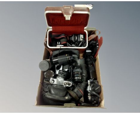 A box of two camera bags containing Pentax and Olympus cameras, Minolta flash, assorted lenses etc 