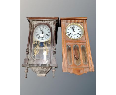 A Polaris wall clock together with a further 31 day wall clock.