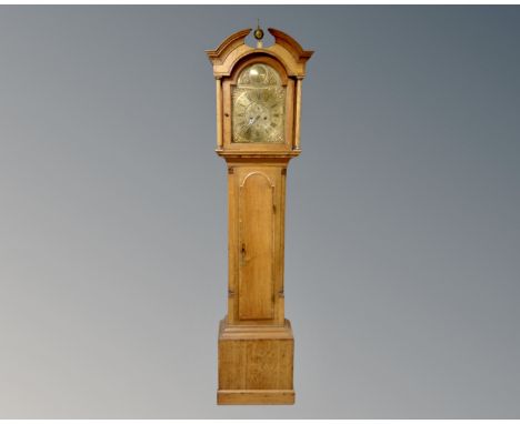 A 19th century inlaid oak longcase clock with brass dial, no pendulum or weights.