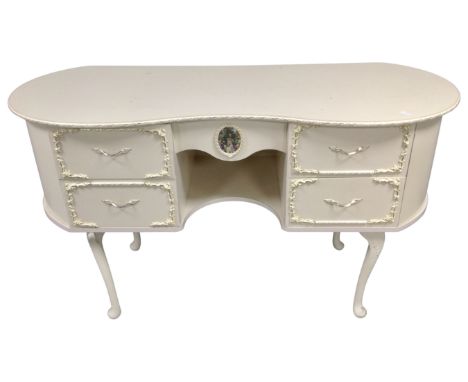 A cream and gilt kidney shape dressing table. (no mirror)