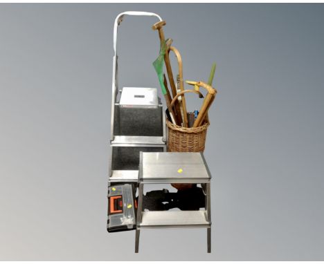 A set of aluminium folding steps together with a further folding stool step, a plastic toolbox and a wicker basket containing
