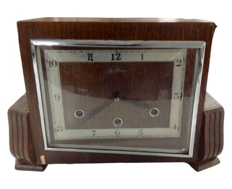 An oak cased Art Deco mantel clock.