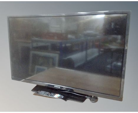 A Hitachi 32" LCD Smart TV with remote.