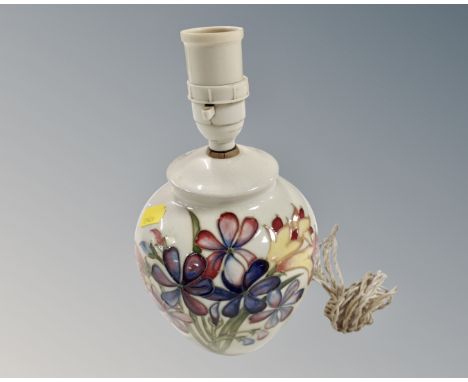 A Moorcroft floral pattern table lamp on white ground, lamp base 16cm 