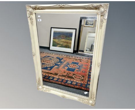 A contemporary cream mirror, 75cm by 106cm.
