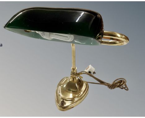 A vintage brass banker's desk lamp with green glass shade 