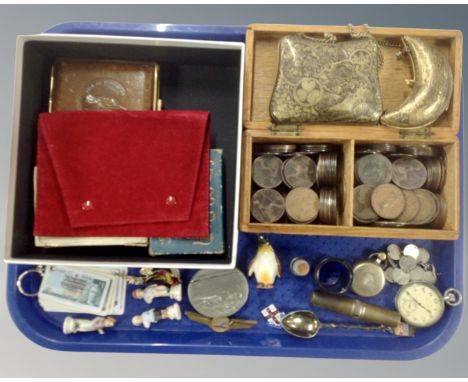 A tray containing a pewter snuff box, a pocket watch, a coin bracelet, two eastern brass purses.