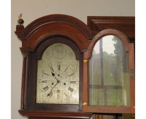 A George III mahogany longcase clock, the hood with arched top flanked by reeded brass capped Corinthian columns, the silvere