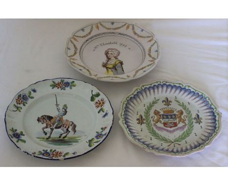 A 19th century French faience plate painted in polychrome with a knight on horseback, floral border, 25cm diam, another with 