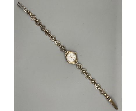 A 9ct gold ladies Rotary watch on a 9ct gold bracelet . Champagne dial with Arabic numerals/ batons. Case diameter approximat