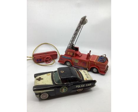 Tin plate 1960s Toy car and fire engine with power box( untested as vintage) An 8” toy Police car and  a tinplate 10” fire tr