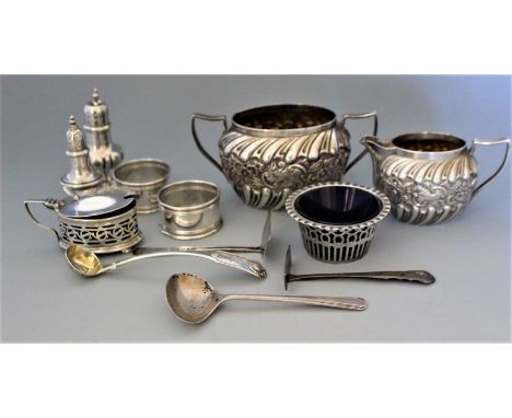 A quantity of silver to include cream jug and twin handled sugar basin with wrythen and repousse decoration, Birmingham 1892,