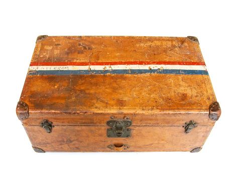 A 1920's Louis Vuitton steamer trunk, tan leather throughout with studded corner guards and painted French flag to the top, t