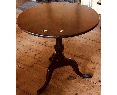 A George III mahogany circular occasional table, circa 1800, turned column on tripod platform on cabriole padded feet.