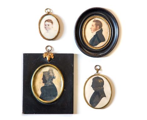 Four assorted 19th Century oval portrait miniatures, a Regency gentleman in profile, a young lady and two profile silhouette 