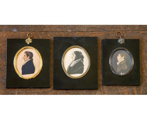 Three mid 19th Century oval watercolour portrait miniatures, all subjects in profile, to include a young gentleman attributed