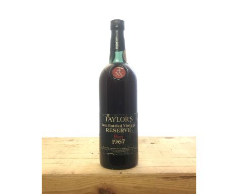 A bottle of Taylors Late Bottled Vintage Reserve Port, 1967. Description:Quantity: 1 bottle Condition: Some minor damage to l