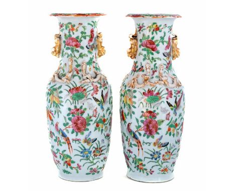 A pair of 19th Century Cantonese enamel baluster vases, decorated in the famille rose palette with exotic birds and insects a