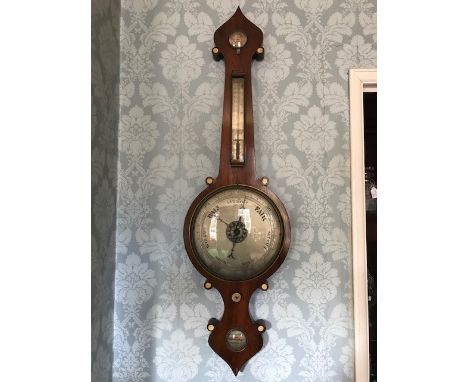 A William IV rosewood wheel barometer, circa 1830, ogee finial, dry/damp gauge, thermometer, barometer and level with silvere