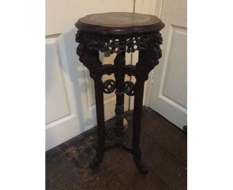 A 19th Century Chinese marble inset hardwood jardinière stand, frieze carving in tripod for saber reversed scrolled feet.