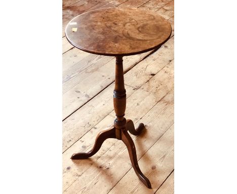 A George III fruitwood wine table, circa 1800, circular top above a turned column on a tripod platform, raised on three cabri