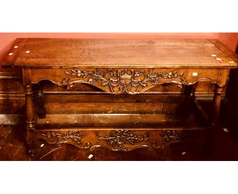 An 18th Century walnut serving table, rectangular top above carving of floral decoration on turned pillar supports with flora