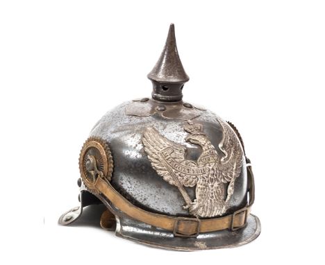 A Prussian 1915 model Jager zu Pferd enlisted man’s helmet,  of blued steel with steel spike and Dragoon eagle plate, the ins