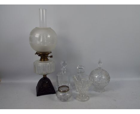 Lot to include a vintage oil lamp and a quantity of glassware including decanters.