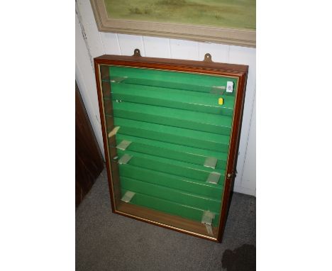 A GLAZED NINE SHELF WALL MOUNTABLE DISPLAY CASE WITH GREEN FELT LINING 