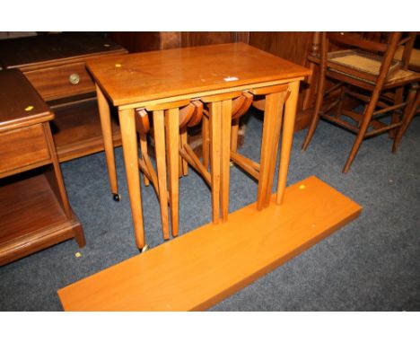 A VINTAGE TEAK NEST OF TABLES AND A SHELF (2)