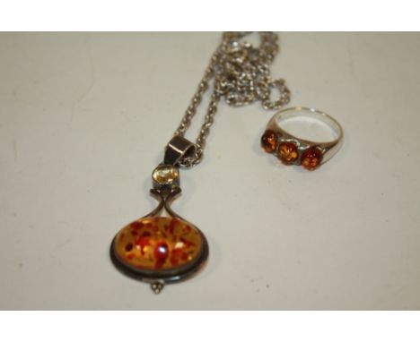 A SILVER AND AMBER RING TOGETHER WITH A SILVER AND AMBER PENDANT ON CHAIN