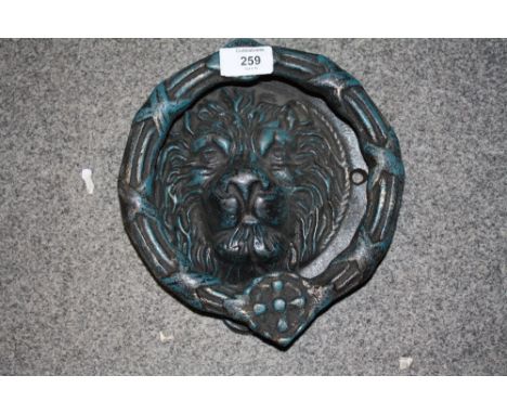 ***A MODERN CAST METAL LION HEAD DOOR KNOCKER