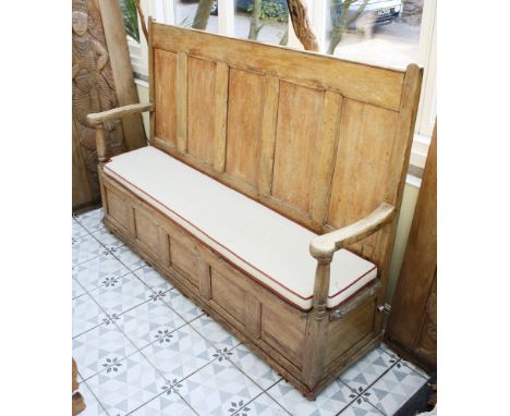 A late 18th century pine & ash settle with five panel back and front and box seat with lifting lid, 65½in. (166.5cm.) wide, 4