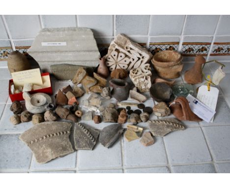 Archaeological interest - A Roman pottery oil lamp together with Roman coins, a marble fragment from Leptis Magna, an Egyptia