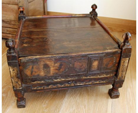 An antique Indian stained and brass mounted walnut square stand or low table with lifting front panel, the corners surmounted