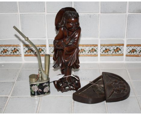 A Japanese carved hardwood figure early 20th century, together with a cloisonné opium pipe and wooden cased opium scales. (3)