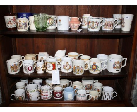 A large collection of Coronation mugs featuring monarchs from Victoria to Elizabeth II, makers including Royal Winton, Wedgwo